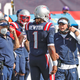 Future king Josh McDaniels instructs Cam Newton as Bill Belichick looks on.